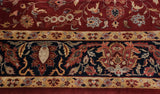 Classic Mohajeran Sarouk design, wine red field to navy blue border with floral tendrils.