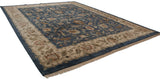 Agra carpet corner: deep denim blue floral field, beige meandering border, and fringe.