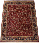 Angled view of a wine red Indian Sarouk carpet, showing the allover floral design and the lush, full pile.