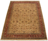 An angled view of a fine Agra carpet, highlighting its golden field and burgundy vine border.