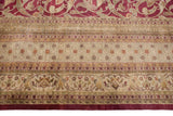 Indian Art Nouveau carpet border detail: cochineal red field with sprawling arabesques, multi-toned ivory bands.