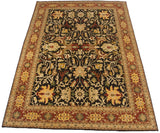 An Indian Serapi carpet's large scale floral palmettes and vinery shown from a full-length angle.