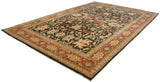 A full-length angled view of an Indian Serapi design carpet with its intricate floral patterns.