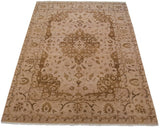 Indian Tabriz design carpet with roundel medallion and intricate floral arabesques in bronze and ivory.