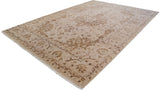 Angled view of traditional Indian Tabriz carpet, with ivory field and bronze floral motifs.