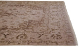 Close-up of Indian Tabriz design rug's bronze serrated leaf border and ivory selvage.
