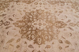 Ivory field with delicate bronze floral leaves and starburst blossoms.