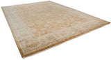 Corner view of Indian Oushak rug, showing ivory border, bronze side selvage, and fringe.