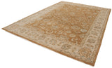 Corner of Indian Oushak design rug, bronze field, ivory serrated palmettes, and vinery.