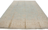 Vintage Indian Oushak carpet corner, showing beige floral border and powder blue field.
