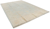 Oushak rug corner with beige border, powder blue field, and intact side selvage.