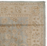 Indian Oushak design rug corner with powder blue field, beige border, bronze palmettes.