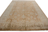 Indian Oushak carpet featuring bronze palmettes, ivory cloudbands, and delicate floral vinery.