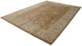 Indian Oushak rug corner: ivory border, bronze field with serrated palmettes, and fringe.