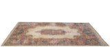 Vintage Kerman carpet with Rococo stylized medallion, spandrels, and floral border in ivory, blue, pink.