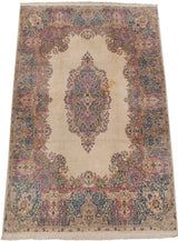 Ivory vintage Kerman carpet with Rococo medallion, reciprocating corner spandrels, blue and pink.