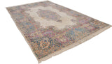 Vintage Kerman carpet corner, showing ivory, blue, and bubblegum pink Rococo floral border.