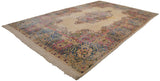 Corner of vintage Persian Kerman carpet with blue, pink Rococo floral sprays, ivory fringe.