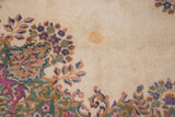Ivory field of vintage Kerman carpet with Rococo floral design and wool staining.