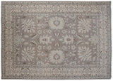 Oxidized silver palmette, vinery, and ivory border on a hand-knotted Indian rug.