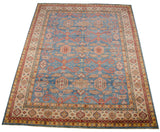 Full perspective view of a Pakistani carpet with classic Caucasian rams horn designs on a blue ground.