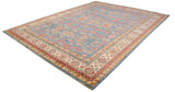 Classic Caucasian Perpedil design with red rams horn motifs across the carpet's sky blue field.