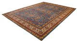 The intricate Perpedil design and layered borders of a fine Pakistani Caucasian carpet viewed from an angle.