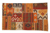 Warm palette patchwork Kilim rug featuring geometric primitive patterns and cross-hatch stitches, 3x5.