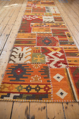 A long perspective of the patchwork kilim runner showcasing its stitched geometric panels.