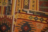 Geometric patterns and raised cross-hatch stitches on warm-toned patchwork kilim.