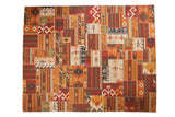 Patchwork Kilim rug with geometric patterns, visible cross-hatch stitches, and warm earthy tones.
