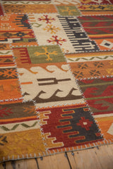 Primitive geometric panels and raised cross-hatch stitching on a patchwork kilim.