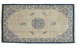 Vintage Indian Peking carpet, circa 1970s, with ivory field and blue medallion and cloudband patterns.