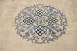 Plush ivory field with indigo and cobalt blue Peking vinery and lattice design.