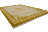 Gold scrolling vinery border with pearl motif on ivory Peking rug corner, plush pile.