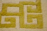 Thick plush saffron yellow and ivory geometric pattern on a vintage Indian Peking carpet.