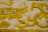 Thick plush saffron yellow cloudband motifs on ivory vintage Indian Peking rug pile.