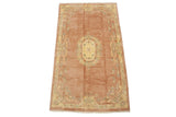 Rose vintage Indian Aubusson carpet with oblong cameo floral medallion.