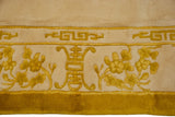 Saffron yellow cloudband and germinating plant motifs on an ivory Peking design rug border.