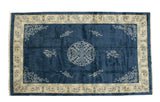 Vintage Indian Peking rug: cobalt blue field, roundel medallion, cloudband motifs, ivory floral border, plush pile.
