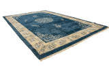 Plush cobalt blue field, ivory border, with cloudband and germinating plant motifs.