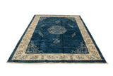 Plush blue field and ivory border with cloudband and plant motifs on the Peking rug.