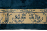 Indian Peking rug main border with blue germinating plants and geometric motifs on ivory.