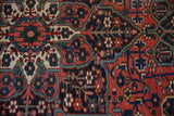Evenly worn hand-knotted pile of a vintage Baktiari rug showing detailed floral motifs.