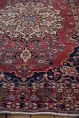 Low angle view of the hand-knotted pile on a vintage Baktiari rug with detailed scrolling arabesques.