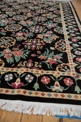 Dense hand-knotted pile of an Indian carpet with a floral Arts and Crafts border and clean white fringe.