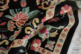 Thick, plush pile of a vintage Indian Arts and Crafts carpet with a detailed floral and quatrefoil border.