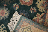 Ivory fringe, geometric reverse, and green floral pile of a vintage Indian Arts and Crafts rug.