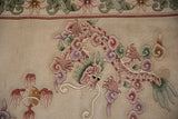Dimensional dragon and cloudband motif with thick pile, showing mauve, green, and ivory.