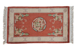 Terra cotta pictorial Peking rug with dragon medallion and corner dragons, ivory border, 3x5